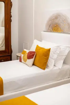 Letto o letti in una camera di Tra Duomo e Uffizi Appartamenti moderni nel cuore dell'arte