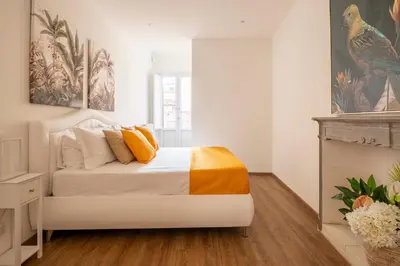 Letto o letti in una camera di Tra Duomo e Uffizi Appartamenti moderni nel cuore dell'arte