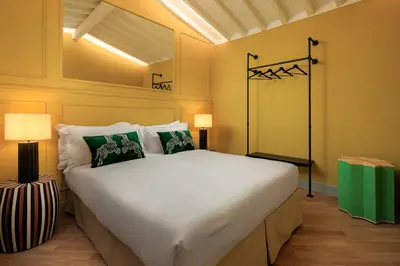 Letto o letti in una camera di ENCHANTING PENTHOUSE with a breathtaking 360 degrees Panoramic View in the Heart of Florence