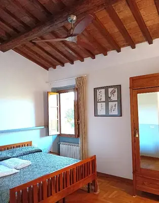 Letto o letti in una camera di Le Corti - Agriturismo Olio e Vino