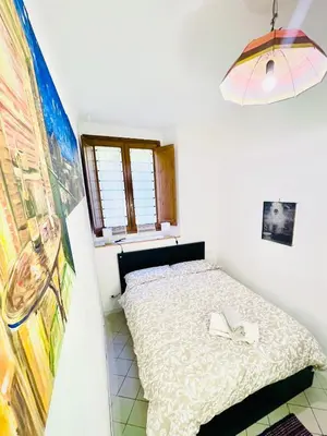 Letto o letti in una camera di Tiny Apartment 8
