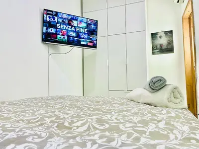 Letto o letti in una camera di Tiny Apartment 8