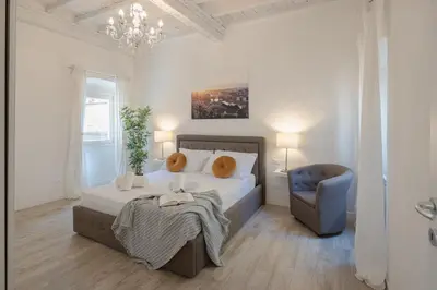 Letto o letti in una camera di Sant'Ambrogio Terrace Tales Apartment