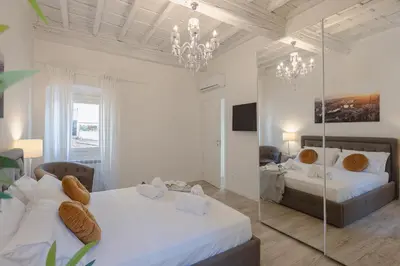 Letto o letti in una camera di Sant'Ambrogio Terrace Tales Apartment