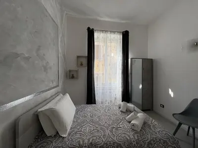 Letto o letti in una camera di Modern Apartment Soggiorno Giovanni dalle bande Nere