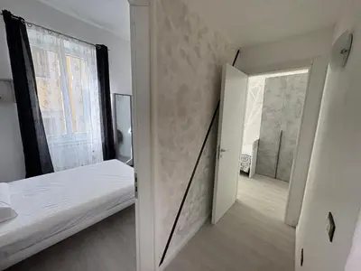 Letto o letti in una camera di Modern Apartment Soggiorno Giovanni dalle bande Nere