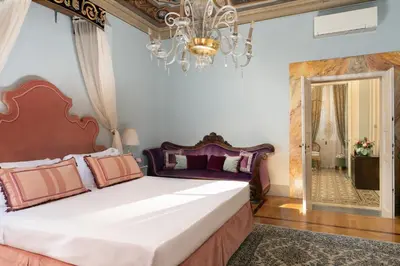 Letto o letti in una camera di Piazza Pitti Palace - Residenza d'Epoca