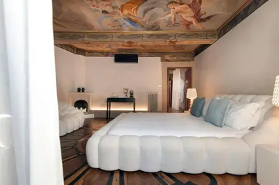 Letto o letti in una camera di Piazza Pitti Palace - Residenza d'Epoca