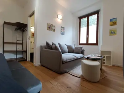 Area soggiorno di Festina Lente Suites 1