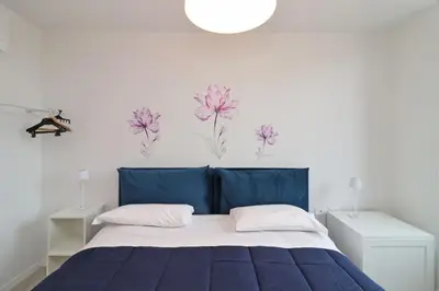 Letto o letti in una camera di Suite Rose