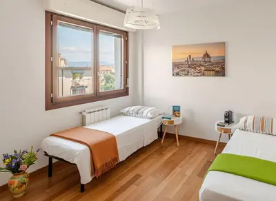 Letto o letti in una camera di Spacious, with private Parking, 2 bedrooms 2 bathrooms - Comfortable and Bright Apartment in Florence with Private Parking Garage - Just Few Minutes walking From Historic Center