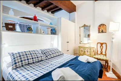 Letto o letti in una camera di Apartment Magnoli&Ponte Vecchio