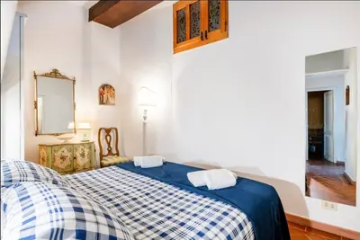 Letto o letti in una camera di Apartment Magnoli&Ponte Vecchio