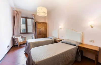Letto o letti in una camera di Apartments Florence- Ariento Bacco 3bdr San Lorenzo