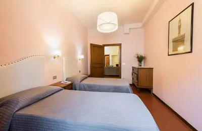 Letto o letti in una camera di Apartments Florence- Ariento Bacco 3bdr San Lorenzo