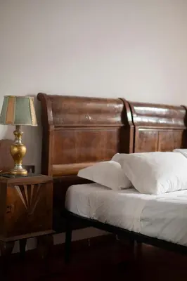 Letto o letti in una camera di Caravaggio House 2 Suite Private nell'Oltrarno Artistico