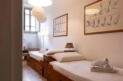 Letto o letti in una camera di Ponte Vecchio Deluxe Apartment