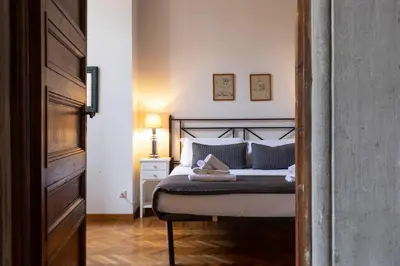 Letto o letti in una camera di Ponte Vecchio Deluxe Apartment