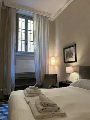 Letto o letti in una camera di Palazzo Mormorai