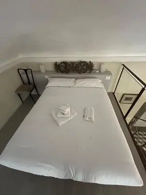 Letto o letti in una camera di Palazzo Mormorai