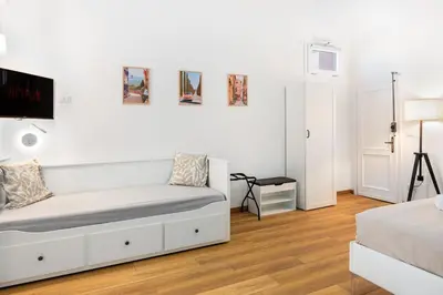 Letto o letti in una camera di Machiavelli Penthouse