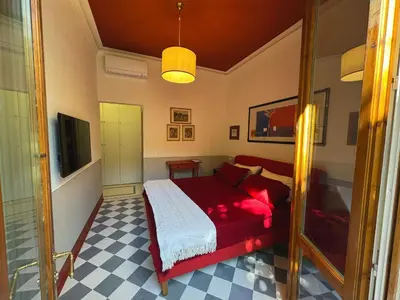 Letto o letti in una camera di Notes of Florence - Stylish Suite in an Authentic Area