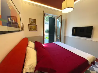 Letto o letti in una camera di Notes of Florence - Stylish Suite in an Authentic Area