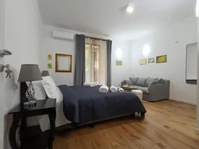 Letto o letti in una camera di Festina Lente Suites 2