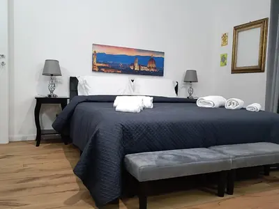 Letto o letti in una camera di Festina Lente Suites 2