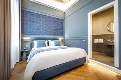 Letto o letti in una camera di Dimora Collection - Le Logge - Historic Boutique Luxury Suites