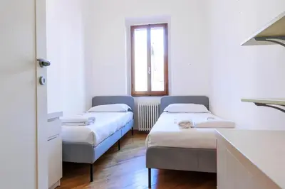 Letto o letti in una camera di Santa Maria Novella Comfort
