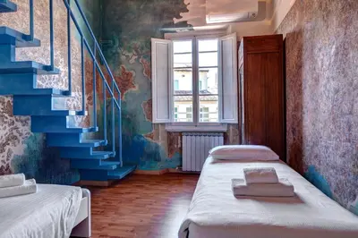 Letto o letti in una camera di Palestro Apartment by Mamo Florence