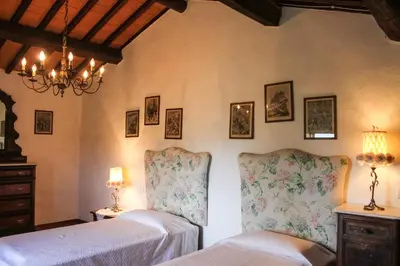 Letto o letti in una camera di Villa Collegalle