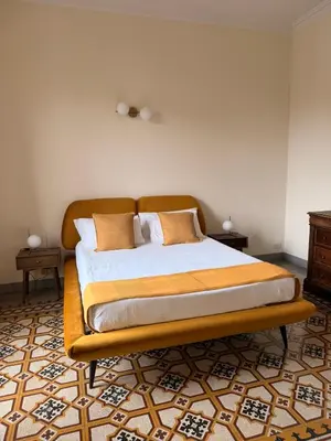 Letto o letti in una camera di Dimora Patella - Firenze