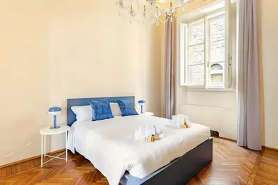 Letto o letti in una camera di Palazzo Bartolommei centralissimo Ponte Vecchio Uffizi