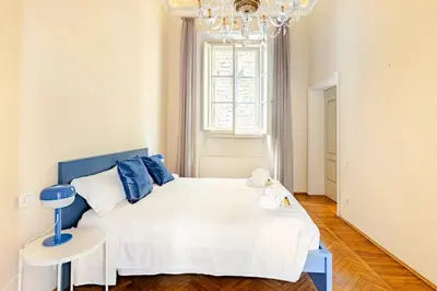 Letto o letti in una camera di Palazzo Bartolommei centralissimo Ponte Vecchio Uffizi