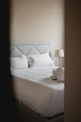 Letto o letti in una camera di Florence Casina Art Riverside Residence