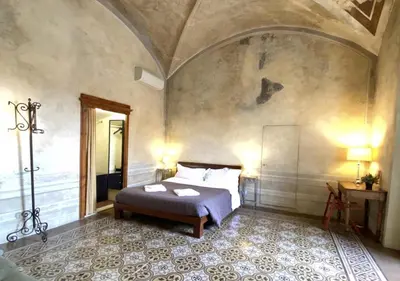 Letto o letti in una camera di Studio Bargello