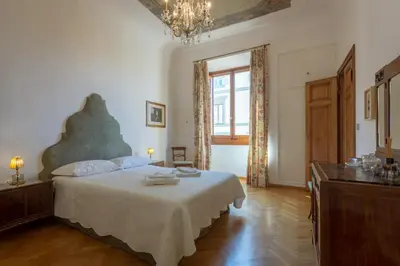 Letto o letti in una camera di The Suite Dome Apartment by Mamo Florence
