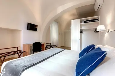 Letto o letti in una camera di B&B Dell'Olio