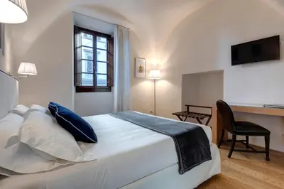 Letto o letti in una camera di B&B Dell'Olio