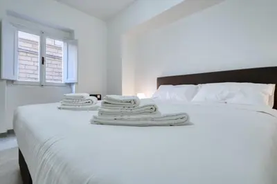 Letto o letti in una camera di Calimaruzza Boutique Apartment