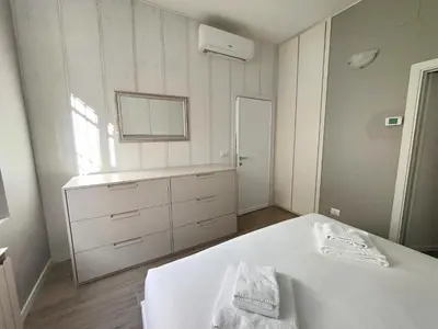 Letto o letti in una camera di Living Firenze