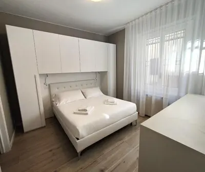 Letto o letti in una camera di Living Firenze