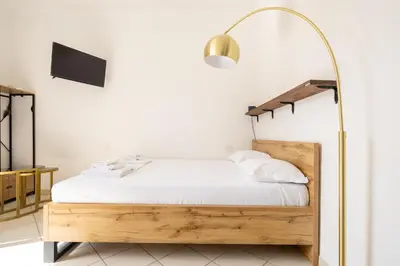 Letto o letti in una camera di Capo di Mondo Apartment