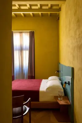 Letto o letti in una camera di The Wheels Florence