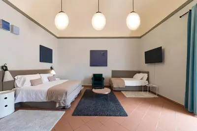 Letto o letti in una camera di The Artists' Palace Florence