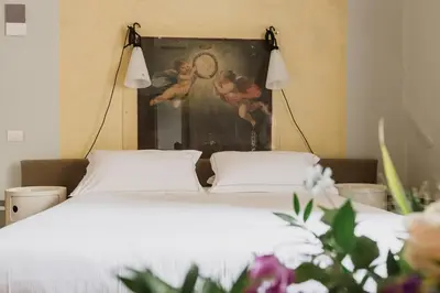 Letto o letti in una camera di The Artists' Palace Florence