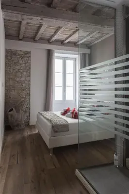 Letto o letti in una camera di Rose Apartment - Santo Spirito district