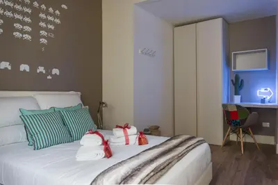 Letto o letti in una camera di Rose Apartment - Santo Spirito district